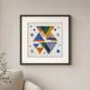 Confetti Triangles by Bassem, art print shown framed on a wall