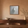 Folded White Flame by Bassem, framed print on a wall