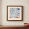 White Loops Over Fire by Bassem, art print shown framed on a wall